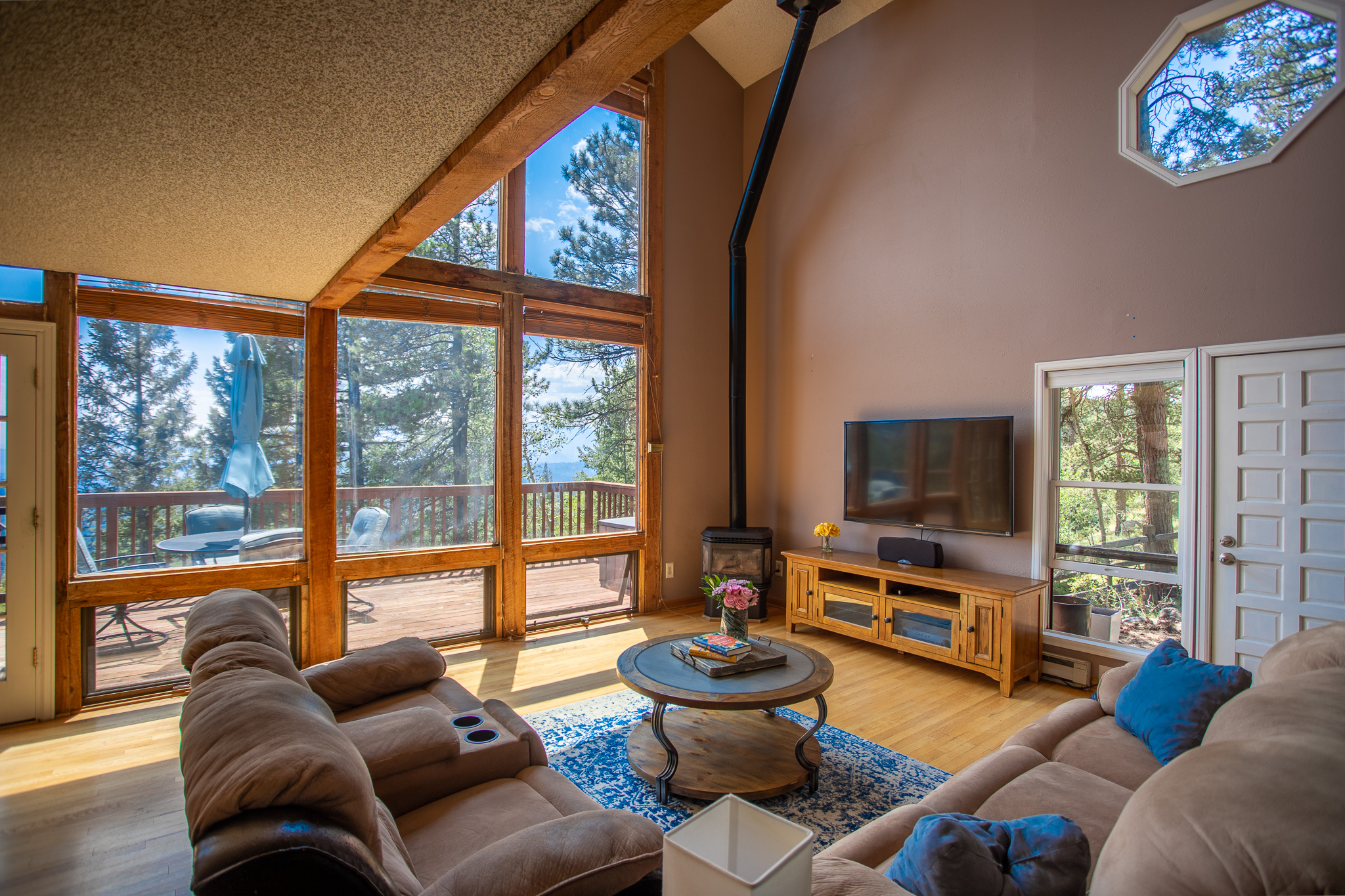 Living room with tall windows and mountain view