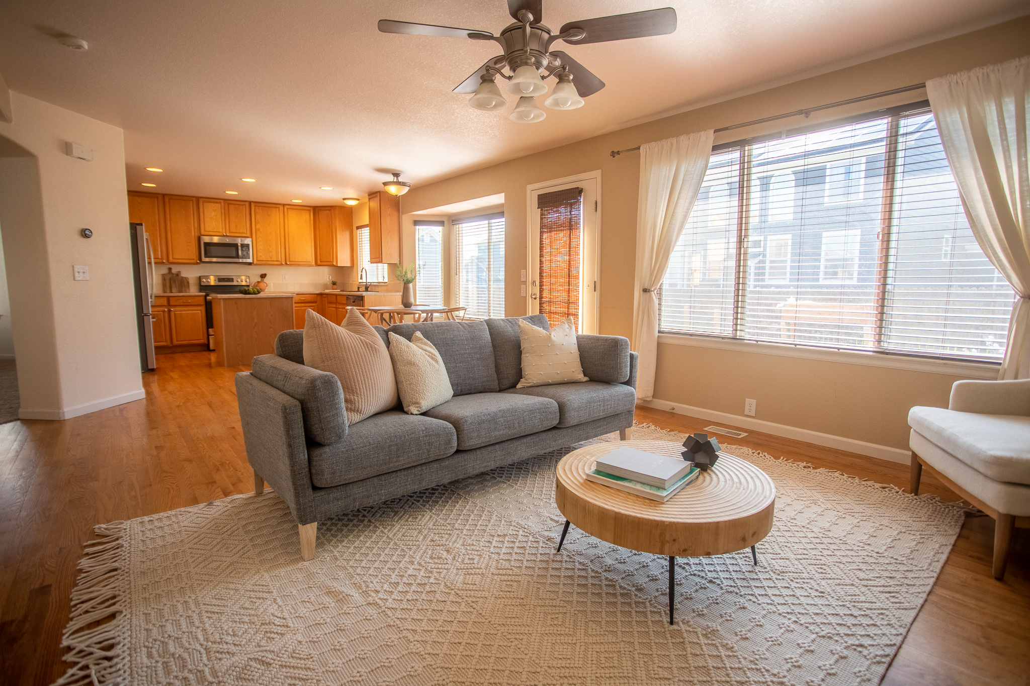 Bright living room connected to a kitchen