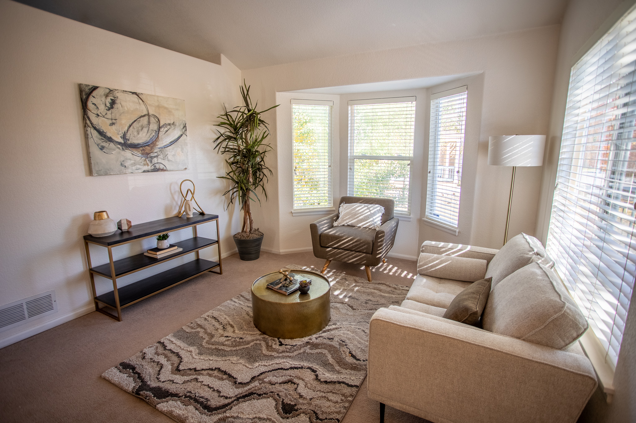 Sitting room with sofa and large windows