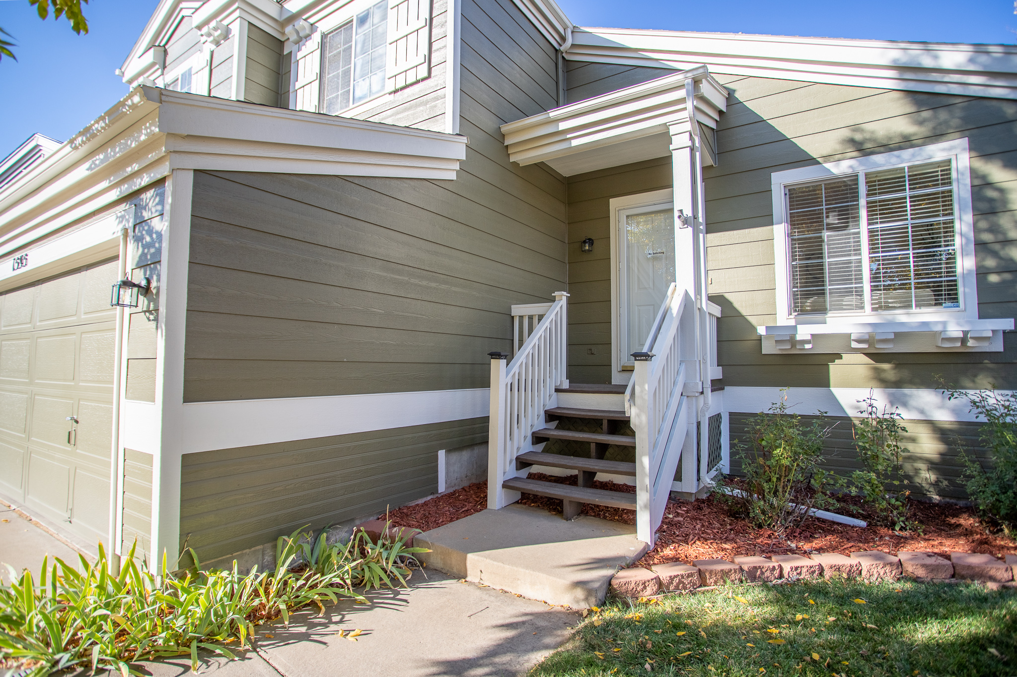 Exterior stairway and front entry of a home